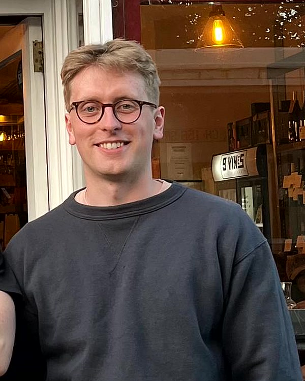 Joe Scrace, founder of webfascia, photographed at a Brighton wine bar